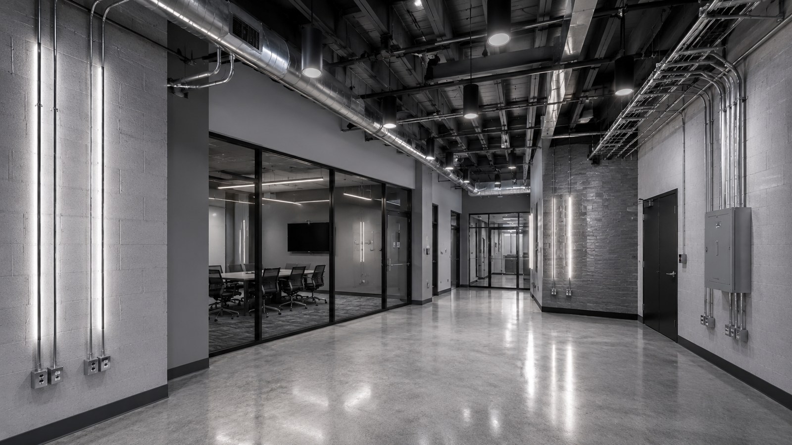 Architect-style visual of a finished commercial tenant improvement interior with coordinated electrical design